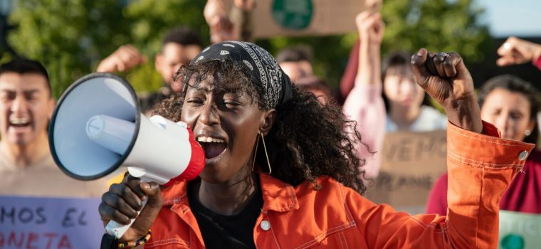 close-up-people-protesting-with-megaphone_23-2148970964